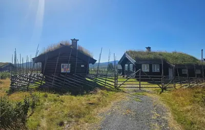a couple of houses with a grass roof at Lovely Home In Røn With House A Mountain View in Ron