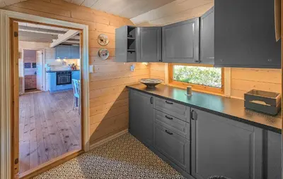 a kitchen with gray cabinets and a counter top at 5 Bedroom Stunning Home In Eggedal in Eggedal