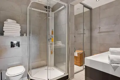 a bathroom with a shower and a toilet and a sink at Fagertoppen 1314B by Vacation Trysil in Trysil
