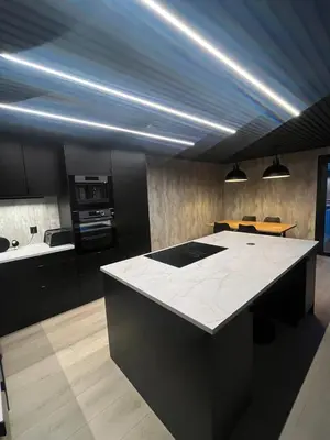a kitchen with a white counter top in a room at Stort hus i Steinkjer in Steinkjer