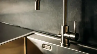 a close up of a kitchen sink with a faucet at Kvitåvatn Fjellhytter in Gaustablikk