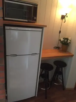 a white refrigerator with a microwave on top of it at Actif 413 - apartment close to Ål Ski Centre in Ål