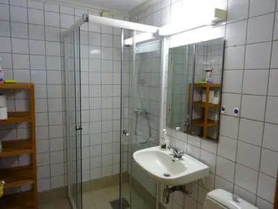 a bathroom with a glass shower and a sink at Actif 413 - apartment close to Ål Ski Centre in Ål