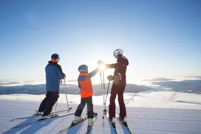 a group of three people standing on top of a ski slope at Cabin at Norefjell ski resort, nice view in Noresund
