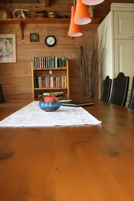 a dining room table with a bowl on top of it at Gemütliche Ferienwohnung am Fjord