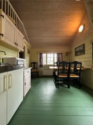 a kitchen and dining room with a table and chairs at Bjorliheimen Fjellhotell-Hytte 10 & 17 in Bjorli