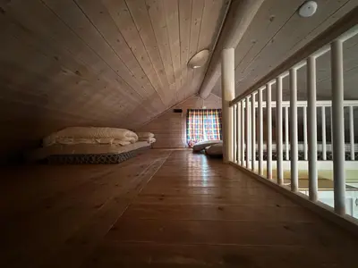 a room with two beds and a wooden ceiling at Bjorliheimen Fjellhotell-Hytte 10 & 17 in Bjorli