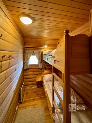 a log cabin with two bunk beds in it at Beitostølen Cabin - Sauna, large terrace and BBQ in Beitostøl