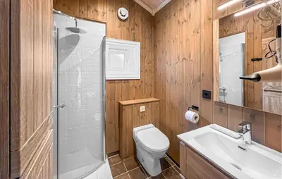 a bathroom with a shower and a toilet and a sink at 4 Bedroom Cozy Home In Nordberg in Nordberg