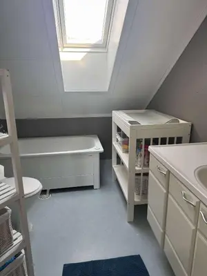 a bathroom with a sink and a bath tub at Korssundvegen 230 in Korssund
