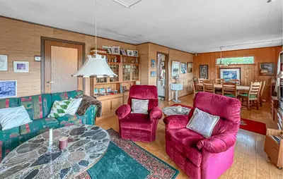 a living room with a table and two chairs at Lovely Home In Hamar With Wifi in Hamar