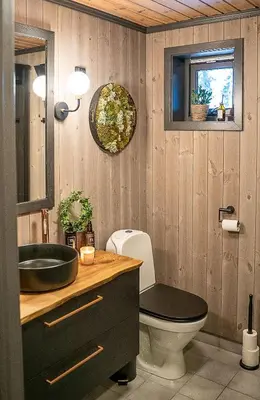 a bathroom with a sink and a toilet and a mirror at Newly Renovated Cabin By Sjusjoen Ski Slopes in Sjusjøen