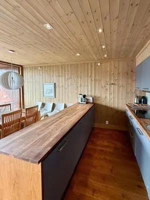 a kitchen with a wooden counter top in a room at Lodge With Views Of Gaustatoppen Mountain in Rjukan