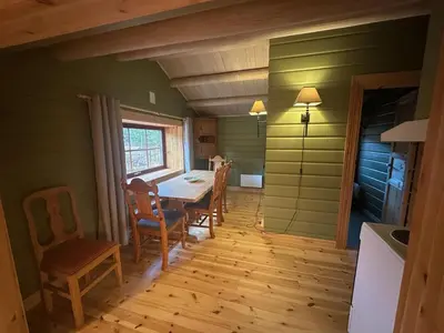 a dining room with a table and chairs at Bjorliheimen Fjellhotell-Hytte 4 og 16 in Bjorli