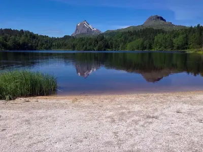 a view of a lake with mountains in the background at Renovated Cabin By Lake Djupedal in Bygstad