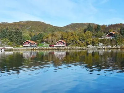 a view of a lake with houses and trees at 6 person holiday home in Bud-By Traum in Bud
