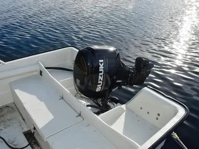 a motor on the back of a boat in the water at 6 person holiday home in Bud-By Traum in Bud