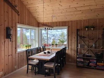 a dining room with a table and chairs at 12 person holiday home in Skare-By Traum in Skare