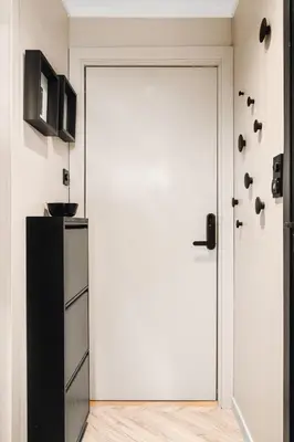a white door in a room with a refrigerator at Modern & Chic Apartment Luxurious Details in Bergen
