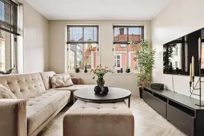 a living room with a couch and a table at Modern & Chic Apartment Luxurious Details in Bergen