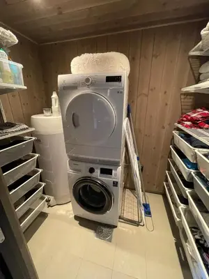 a washer and dryer sitting in a laundry room at Harevadet 217 in Volda