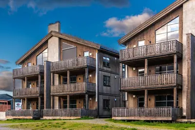 an apartment building with balconies on the side of it at Trysiltunet 10B in Trysil