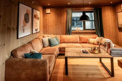 a living room with a couch and a coffee table at Trysiltunet 10B in Trysil