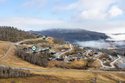 an aerial view of a village on a mountain at Panoramahytte med fjellutsikt in Sogndal