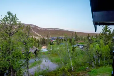 a view of a village with a river and trees at Trysilfjellet Nord 901 in Trysil