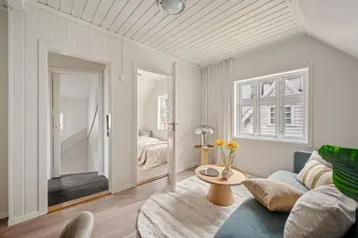 a living room with a couch and a table at Charming apt in the centre of Bergen in Bergen