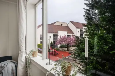 an open window with a view of a yard at Historic retreat in the middle of town in Bergen