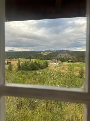 a view of a field from a window at Peaceful cabin with secluded location in Ål