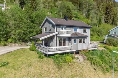 an aerial view of a house on a hill at The top half of a house with sea view in Steinkjer