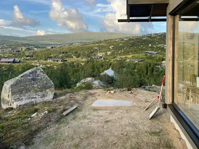 a window of a house with a view of a mountain at Architect-Designed Cabin With Views Of Sigdal in Eggedal
