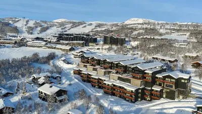 an aerial view of a resort in the snow at Stor Leilighet Med 4 Soverom Og 2 Bad in Beitostøl