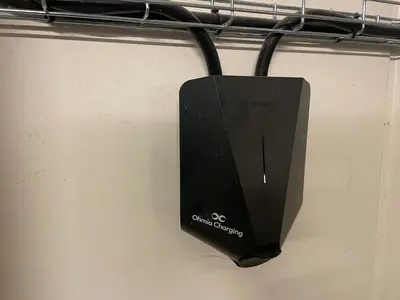 a black speaker is hanging on a rack at Stor Og Moderne Leilighet I Sentrum in Beitostøl