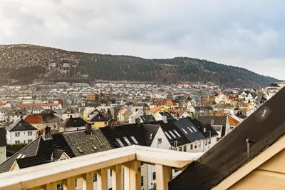 a view of a city from a balcony at Privat rom i koselig Bergenshus in Bergen