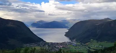 a large body of water between two mountains at Koselig ved Fjorden - Vangsnes in Vangsnes