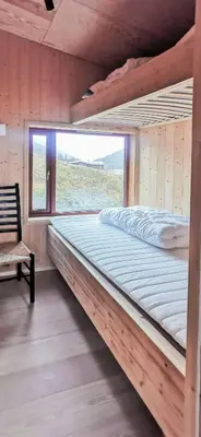 a large bed in a room with a window at Modern Lines And Coziness In Hemsedal in Hemsedal