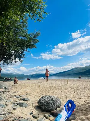 a man standing on a beach with a rock at New cabin in beautiful surroundings in Oppdal