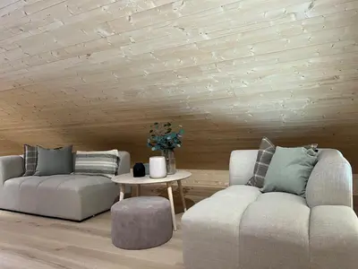 a living room with two couches and a table at New cabin in beautiful surroundings in Oppdal
