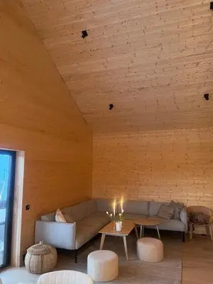 a living room with a couch and a table at New cabin in beautiful surroundings in Oppdal
