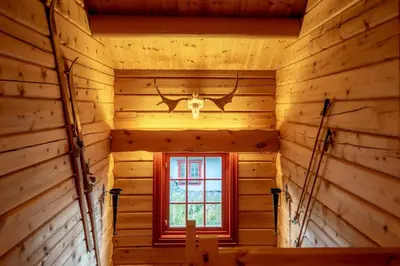 an inside view of a log cabin with a window at Lisetra 716A in Trysil