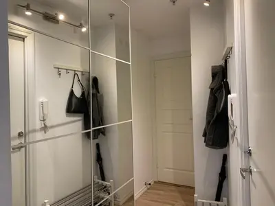 a walk in closet with a glass wall at Stay centrally in a charming and peaceful neighborhood in Bergen