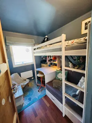 a room with two bunk beds and a desk at Family house in Hemsedal in Hemsedal