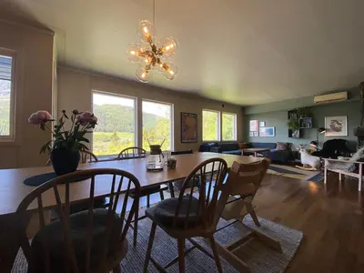 a living room with a wooden table and chairs at Family house in Hemsedal in Hemsedal