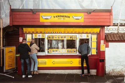 a group of people standing outside of a food truck at Bergen Beds Apartments - A Front Row Experience in Bergen
