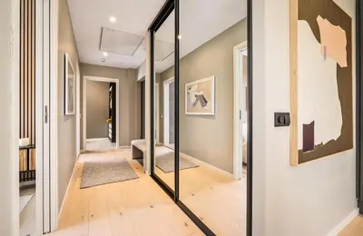a hallway with a mirror in a house at Bergen city centre, fantastic, new apartment in Bergen