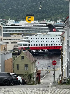 a cruise ship is docked in a harbor at Bergen city centre, fantastic, new apartment in Bergen