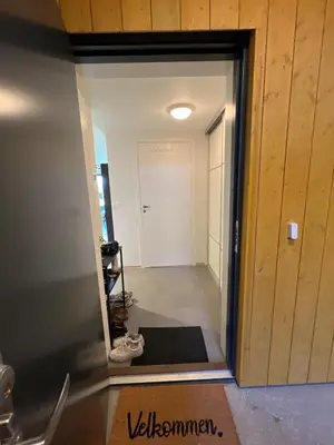 a view of a hallway from the living room at Modern apartment with view in Lii